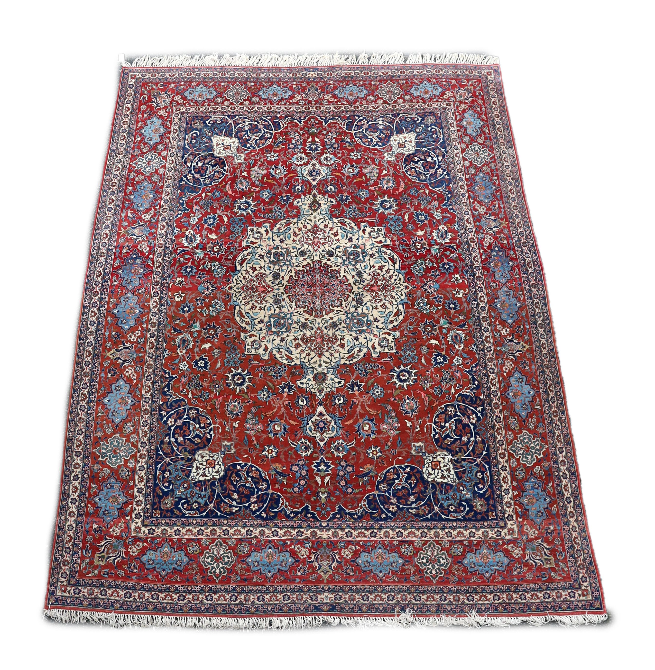 A Isfahan red ground carpet 350 x 260cm.